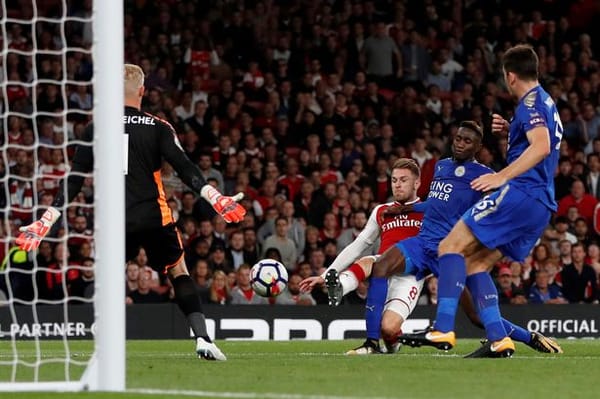 Aaron Ramsey scores past Kasper Schmeichel in a Premier League game