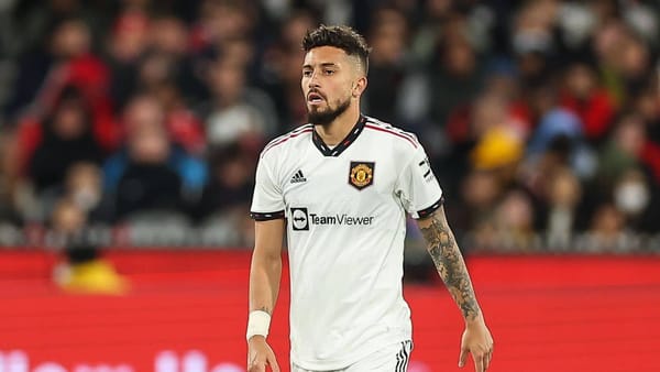 Alex Telles wearing Manchester United's white jersey